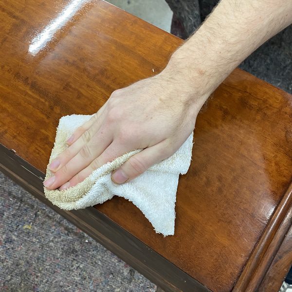 Buffing the finishing wax