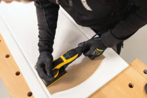 Mirka DEOS II 353 sanding paint off wood
