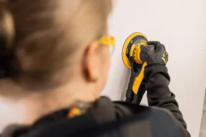 Mirka DEROS II 650 sanding a wall